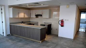 Deluxe Apartment, 1 Bedroom | Private kitchen | Mini-fridge, electric kettle