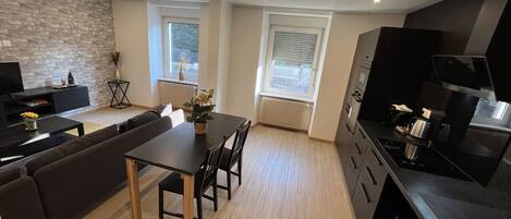 Fridge, coffee/tea maker, cookware/dishes/utensils, dining tables