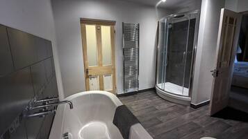 Apartment | Bathroom | Separate bathtub and shower, deep-soaking bathtub, hair dryer, towels