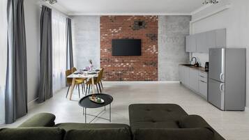 Grand Apartment, City View | Living area | 40-inch Smart TV with cable channels