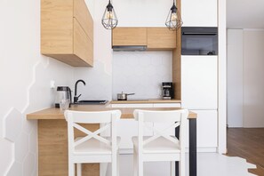 Apartment, 1 Bedroom, Balcony | Private kitchen | Oven, dishwasher, coffee/tea maker, electric kettle - Wrocławska Apartament by Renters (Kraków)