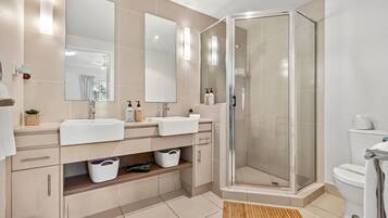 Shower, hair dryer, towels, shampoo