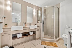 Shower, hair dryer, towels, shampoo