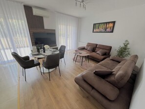 Comfort Apartment, 2 Bedrooms, Terrace, Garden View | Living area | 100-cm TV with digital channels - Dalori Comfort Suite (Zadar)
