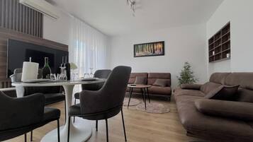 Comfort Apartment, 2 Bedrooms, Terrace, Garden View | Living area | 100-cm TV with digital channels