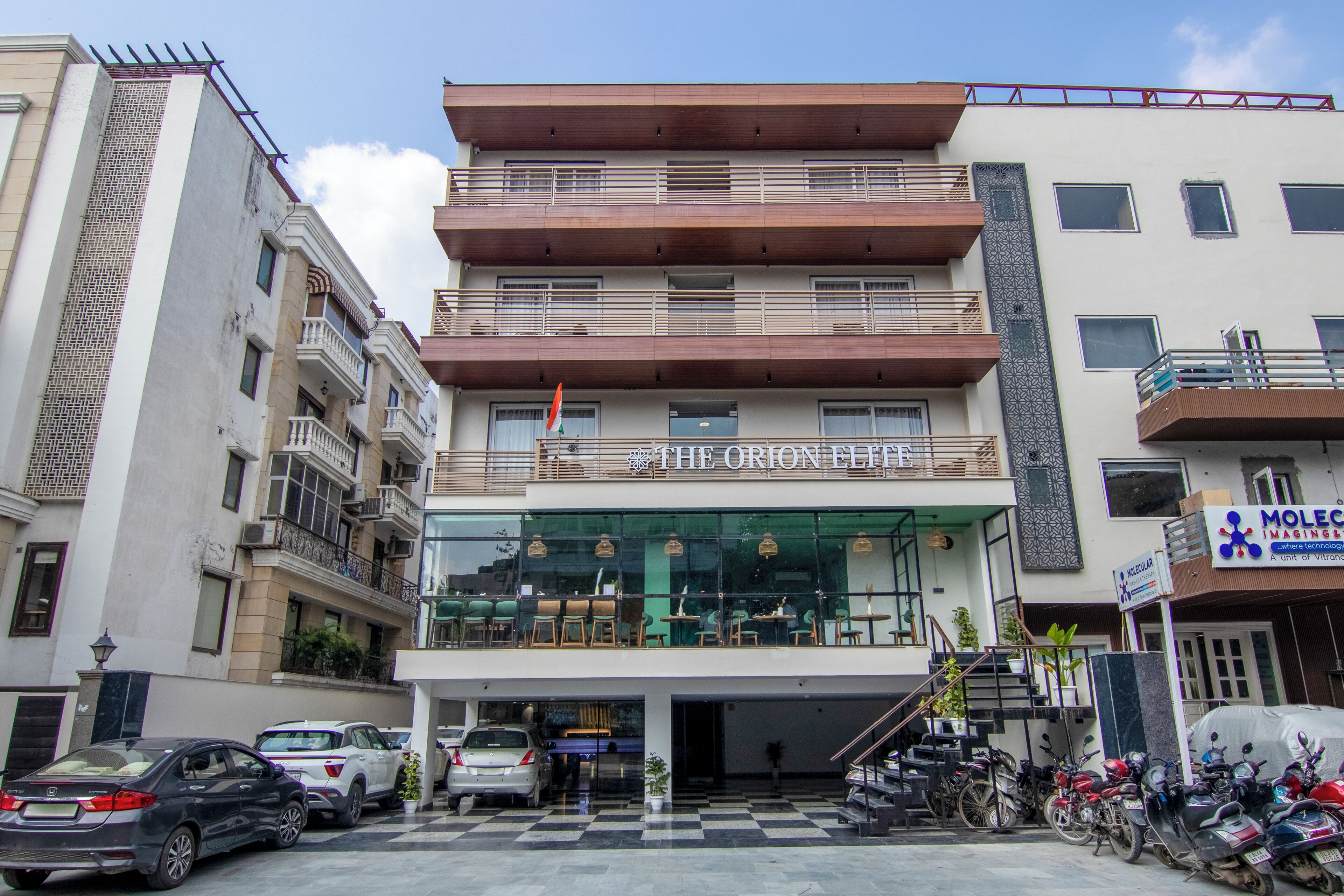 A multi-story building with a restaurant on the ground floor named "The Orion Hotel."