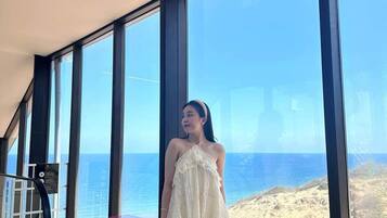 Guests can enjoy breathtaking ocean views from the large window.