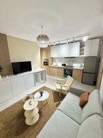 The CosySuit | Living area | 55-inch TV with digital channels, Netflix, streaming services