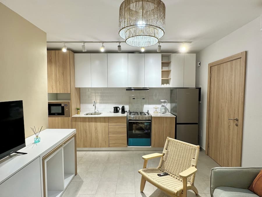 The CosySuit | Zona de estar | Televisión de 55 pulgadas con canales digitales, Netflix