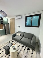 The GreenEden | Living area | 55-inch TV with digital channels, Netflix, streaming services
