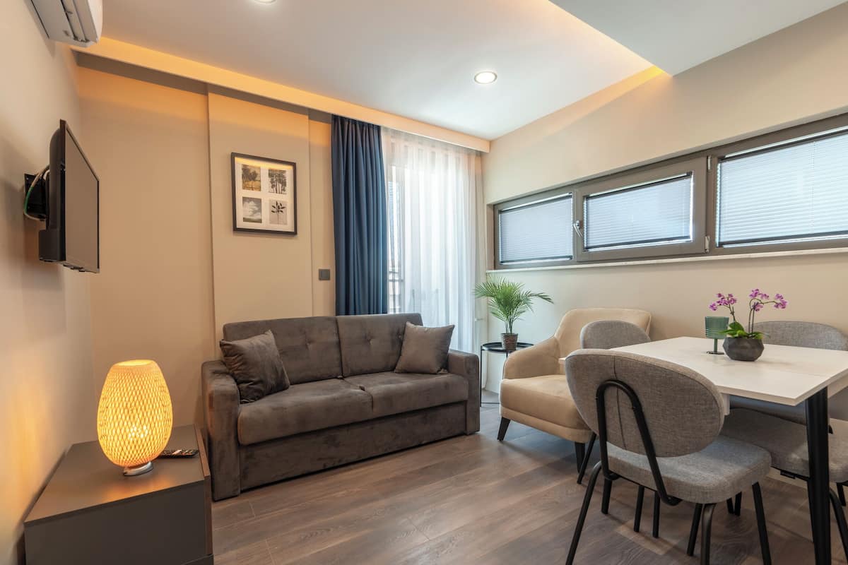 Family Twin Room | Living area | 70-cm Smart TV with satellite channels