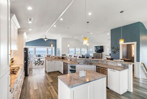 Fridge, microwave, oven, stovetop - Duck oceanfront home with theater room and elevator, steps from the beach! (Duck)