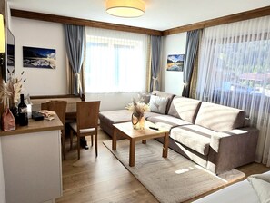 Comfort Apartment, Mountain View | Living area | 32-inch Smart TV with satellite channels