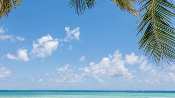 A beach with clear skies and calm waters.
