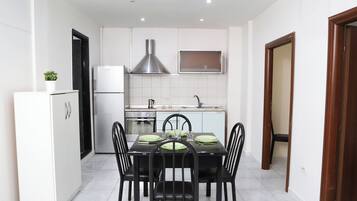 Apartment, Balcony | Private kitchen | Full-sized fridge, oven, stovetop, electric kettle
