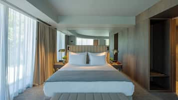 Suite, River View | Minibar, in-room safe, desk, laptop workspace