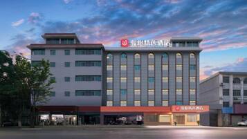 A multi-story hotel with a prominent entrance and signage.