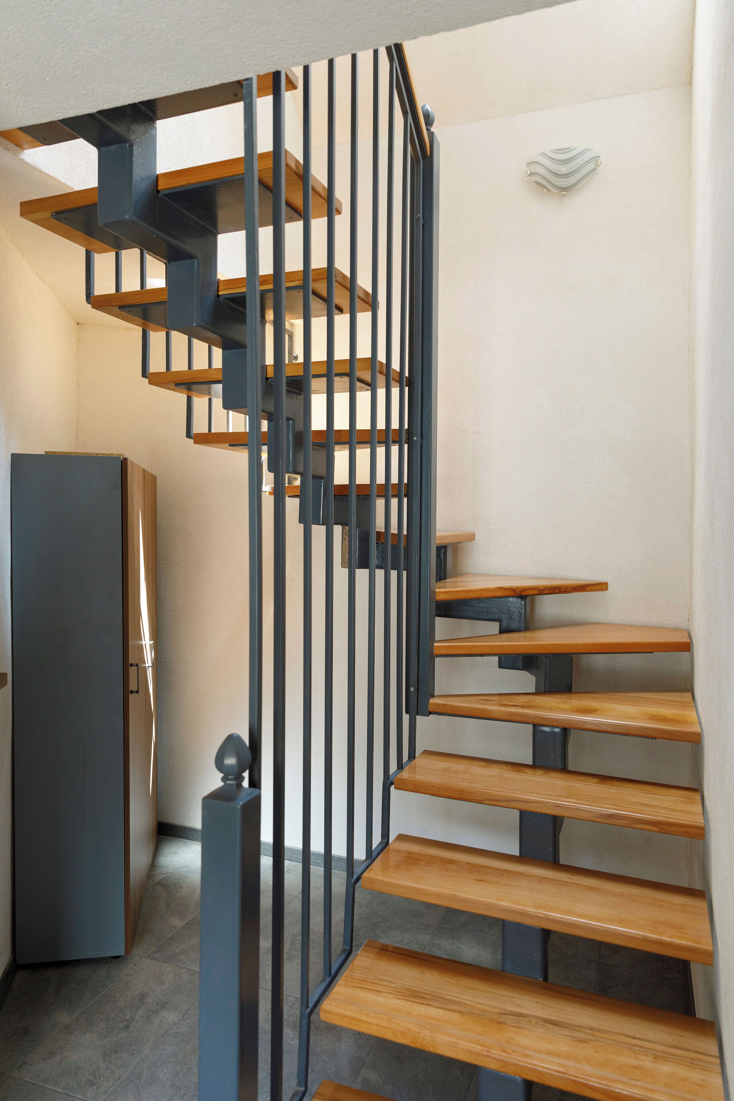 Aki Gray Apartment | Living area | 89-cm Smart TV with cable channels