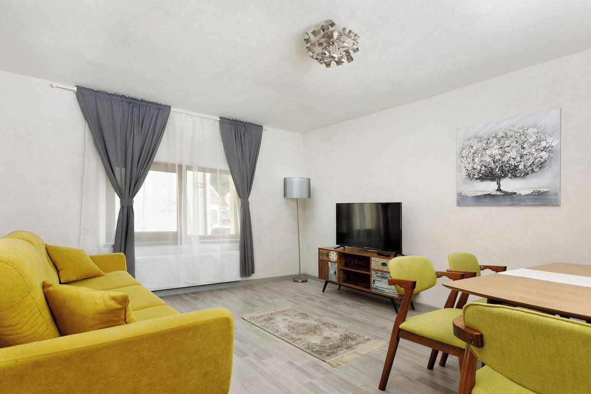Aki Junior Apartment | Living area | 89-cm Smart TV with cable channels