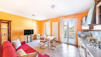 Apartment | Living area | 35-inch flat-screen TV with digital channels