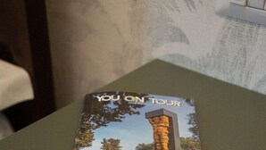 A brochure titled "You on Tour" on a table.