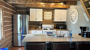 Coffee/tea maker, fridge, microwave, oven