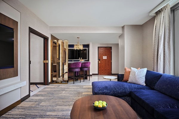 Superior Suite, 1 King Bed, Corner | Living area | 65-inch Smart TV with digital channels, streaming services