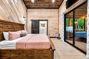 King Suite 2 | Luxurious king bedroom with plush bedding and ample space for ultimate relaxation - Hot Tub | Outdoor Games | Pet-Friendly Cabin (Broken Bow)