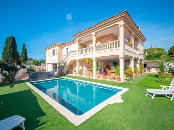 Enjoy a tranquil stay in this villa with a balcony, pool, and lush garden.
