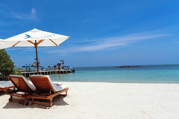 On the beach, white sand, free beach cabanas, sun loungers