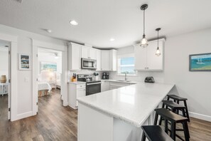 Fridge, microwave, oven, stovetop - Family Tides B – AMI Retreat w/ Pool, Rooftop Deck & Gulf/Bay Views Steps To Beach (Bradenton Beach)