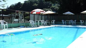 Seasonal outdoor pool, open 9:30 AM to 4:30 PM, pool umbrellas