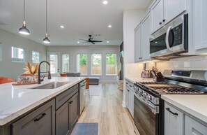 Coffee/tea maker, fridge, microwave, oven