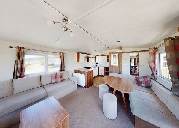 Living area - Well presented 12ft-wide caravan with one double and one twin. (Penhallow)