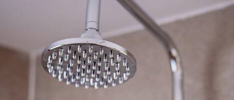 A showerhead with multiple nozzles, a curved shower arm, and a control knob.