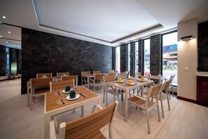 Enjoy meals in a beautifully set dining area with a view.