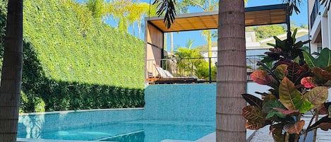 Outdoor pool, open 8:00 AM to 10:00 PM, sun loungers