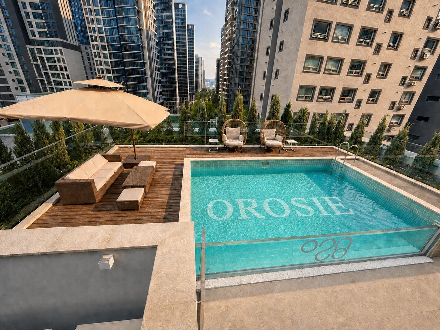 A rooftop pool with the name 'OROSIE' and a number '28' on the edge.