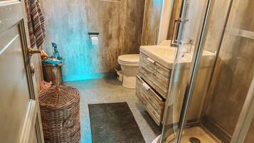 Shower, towels, soap, toilet paper