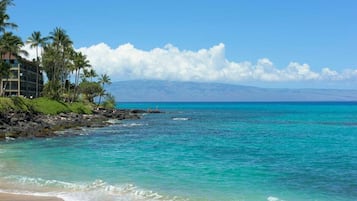 On the beach, sun loungers, beach towels