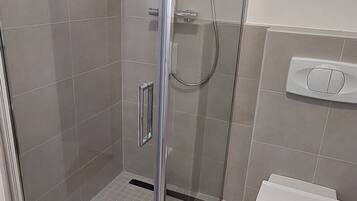 Shower, free toiletries, hair dryer, slippers