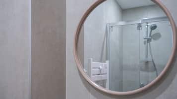 Shower, hair dryer, towels, shampoo