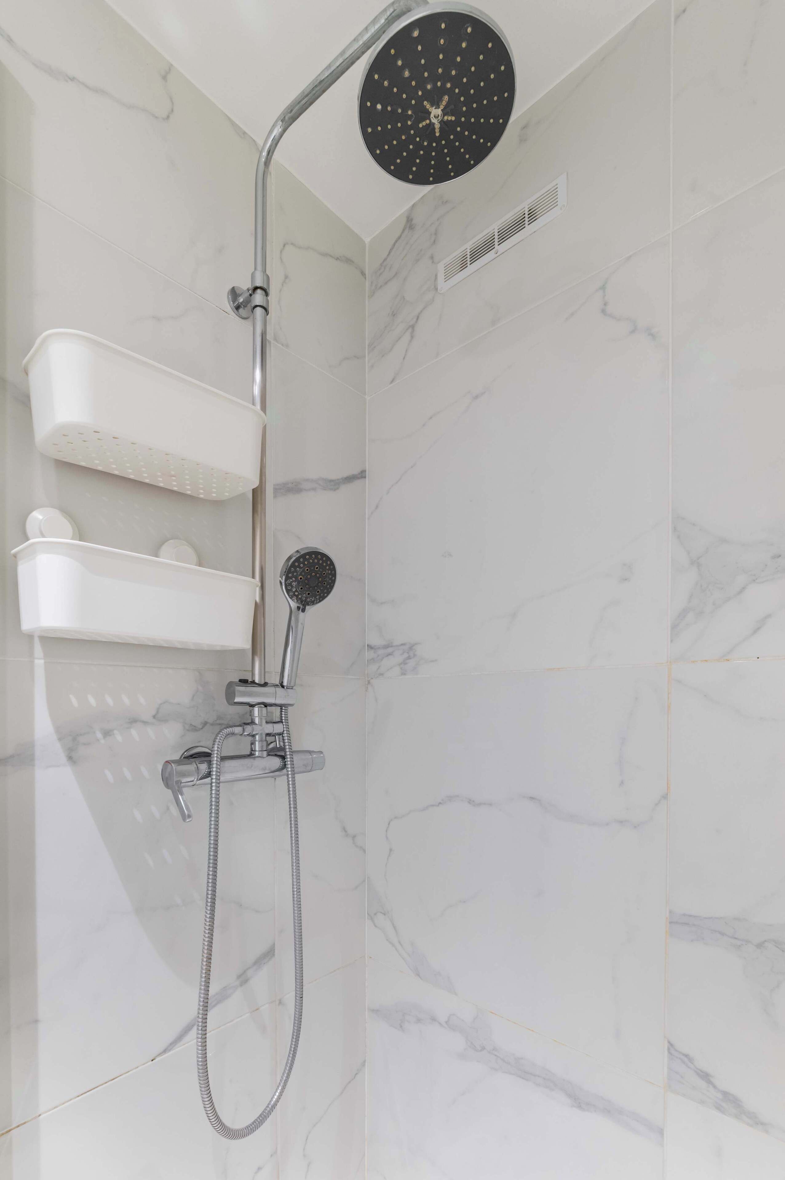 Shower, hair dryer, towels, shampoo