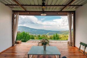 Deluxe House, Air conditioning, Hill View | Living area | 21-inch Smart TV with digital channels - NJ Homestay (Mae Rim)