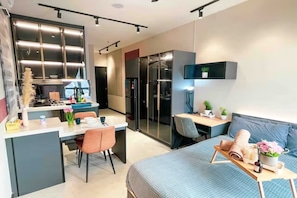 Deluxe Studio | Living area | 43-inch LCD TV with digital channels, Netflix, streaming services