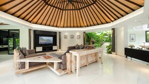 Villa, 5 Bedrooms | Living area | 55-inch Smart TV with digital channels, books - Villa Kubu Dewi Sri by Villa Finder (Canggu)