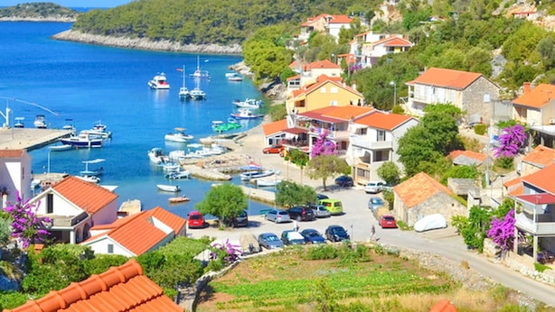A coastal village with houses, a marina, and boats. - Apartments Katica's Place (Blato)
