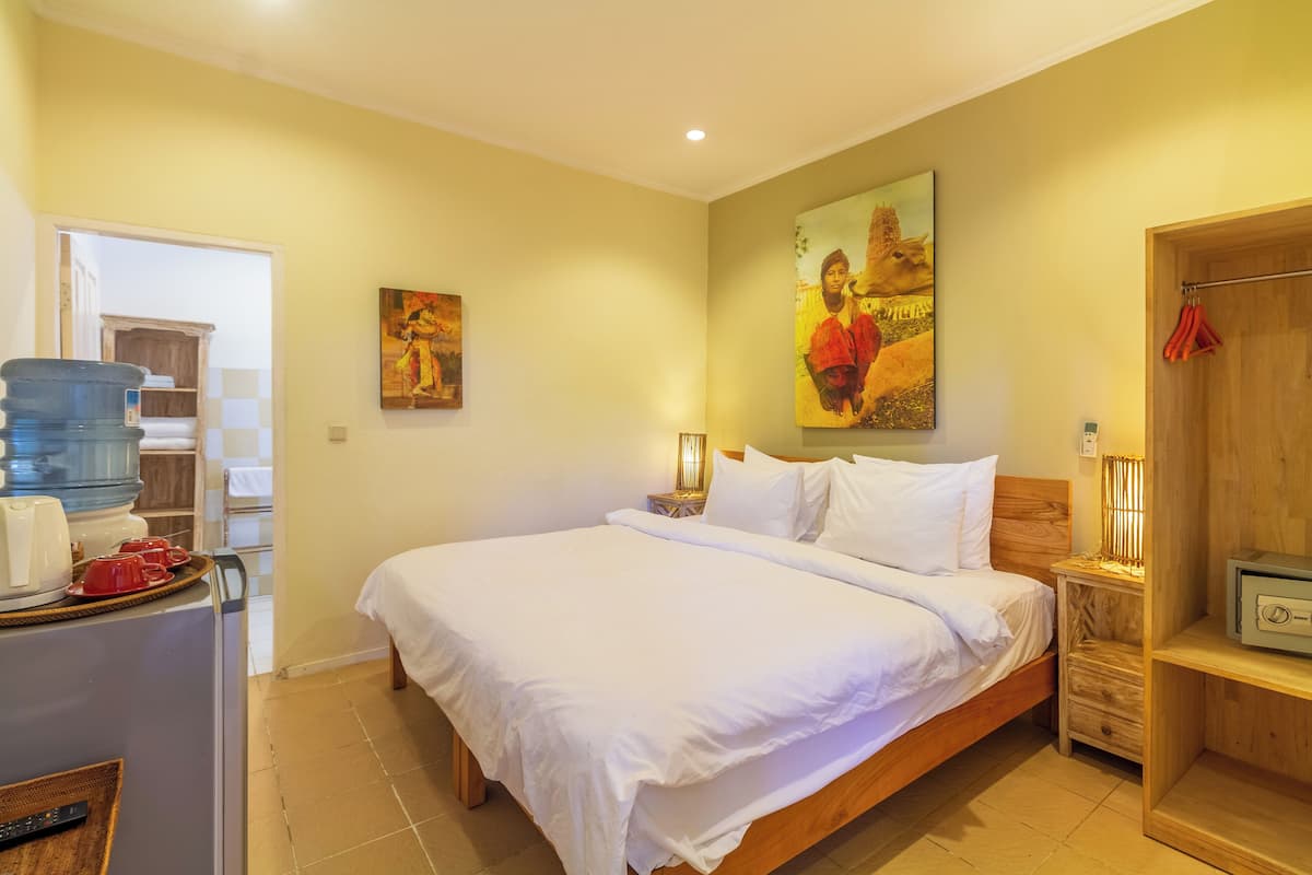 Mango Resort Room | 1 bedroom, in-room safe, desk, iron/ironing board