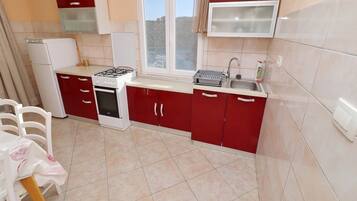 House (Four bedroom Holiday Home with Terrac) | Private kitchen | Fridge