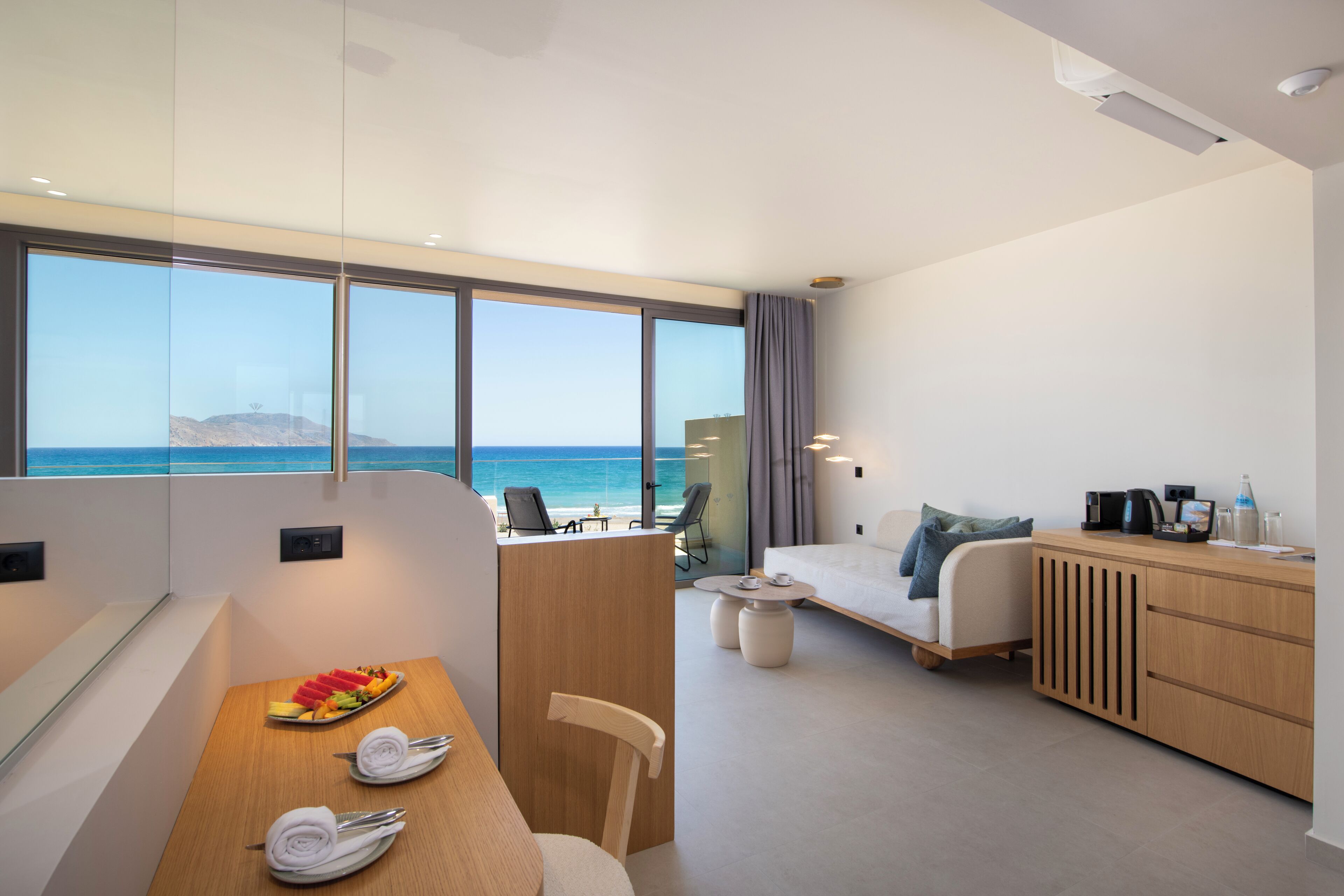 Sky Junior Suite Sea View | Living area | 55-inch Smart TV with satellite channels, streaming services